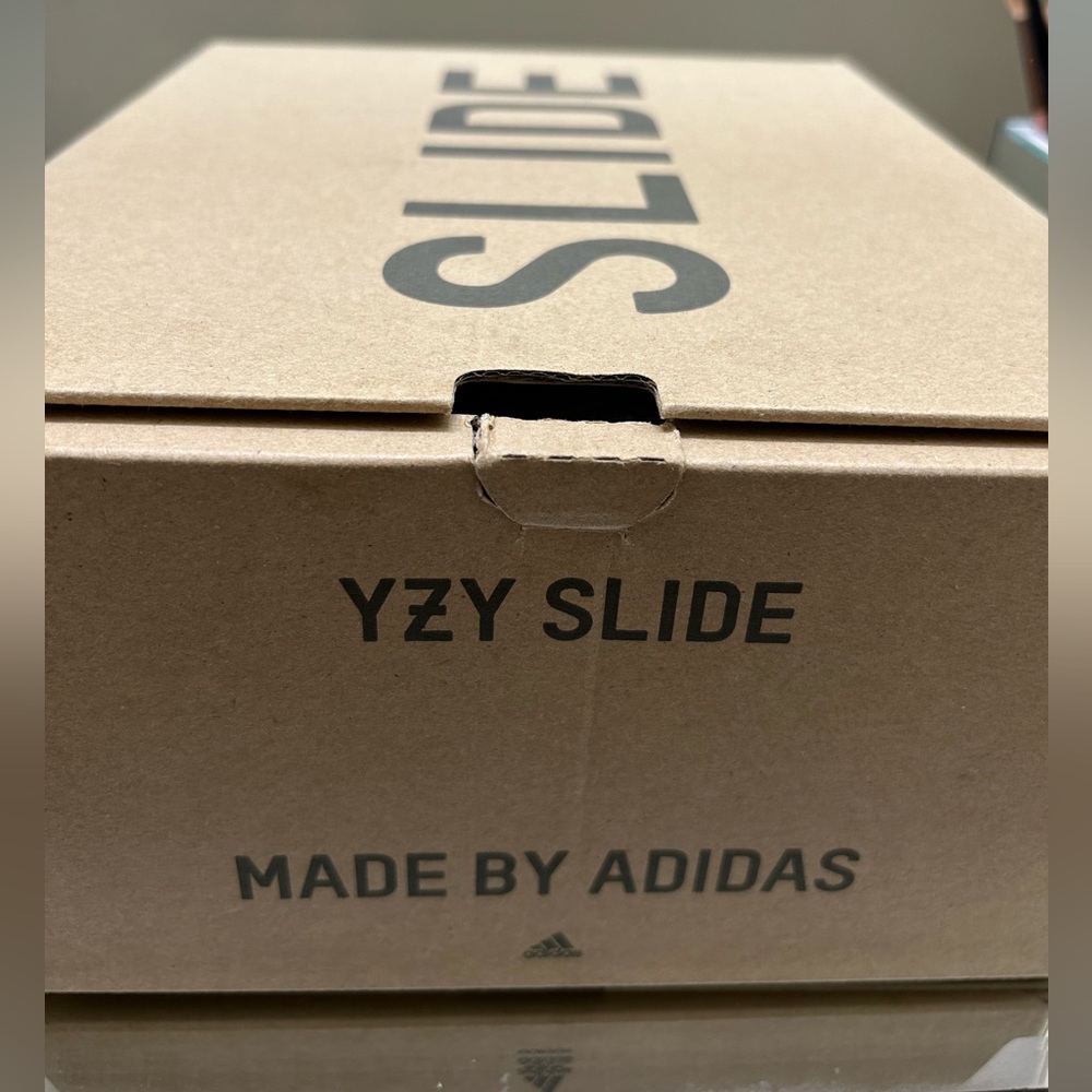Brand new authentic addidas Yeezy slides. Never worn. Got as a gift